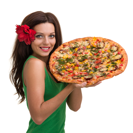 Smiling woman with big pizza isolated on a whiteの写真素材