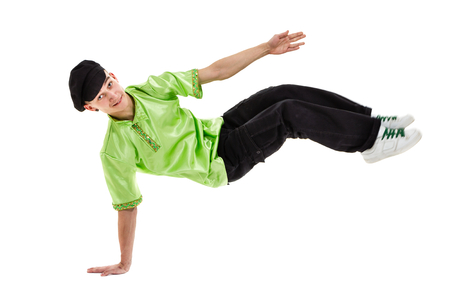young man wearing a folk costume dancing against isolated white background with copyspaceの写真素材