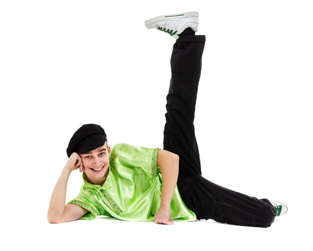 young man wearing a folk costume dancing against isolated white background with copyspaceの写真素材