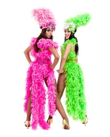 two carnival dancer women dancing against isolated white backgroundの写真素材