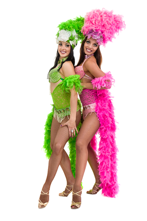two carnival dancer women dancing against isolated white backgroundの写真素材
