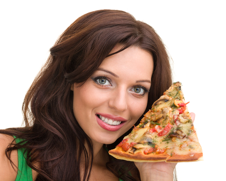 Smiling woman with big pizza isolated on a white backgroundの写真素材