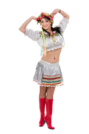 girl in polish national traditional costume posing, full length portrait against isolated whiteの写真素材