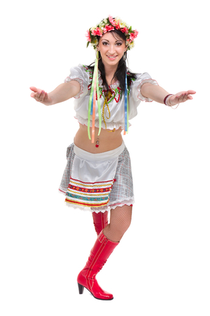 girl in polish national traditional costume posing, full length portrait against isolated whiteの写真素材