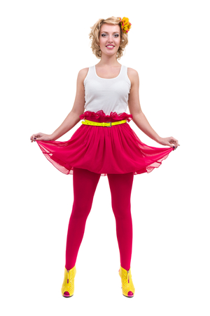 Full length shot of sexy woman in T-shirt and skirt, isolated on whiteの写真素材