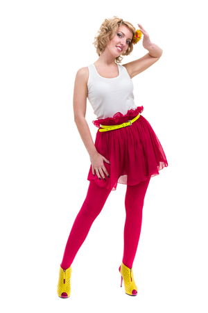 Full length shot of sexy woman in T-shirt and skirt, isolated on whiteの写真素材
