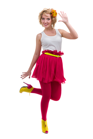 Full length shot of sexy woman in T-shirt and skirt, isolated on whiteの写真素材