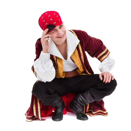 man wearing a pirate costume posing, isolated on whiteの写真素材