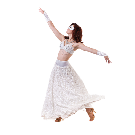 Carnival dancer girl wearing a mask dancing, isolated on whiteの写真素材