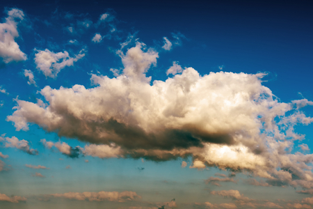 Fantastic white clouds against blue skyの写真素材