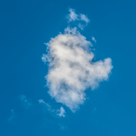 Fantastic white clouds against blue skyの写真素材