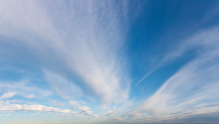Fantastic white clouds against blue skyの写真素材