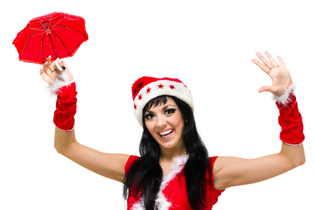 santa girl with an umbrella against isolated whiteの写真素材