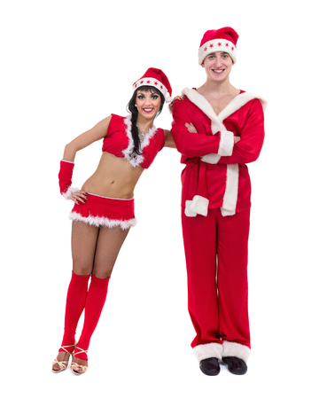 Happy young couple wearing santa claus clothesの写真素材