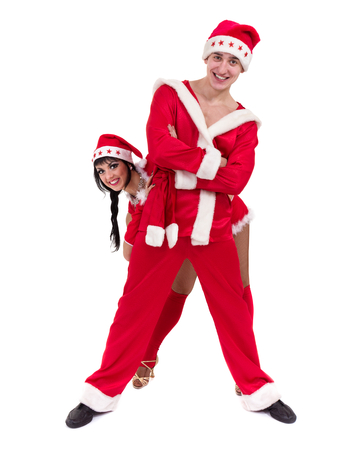 Happy young couple wearing santa claus clothesの写真素材