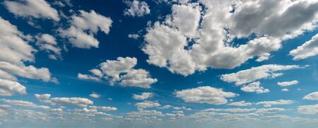 Fantastic white clouds against blue sky, panoramaの写真素材