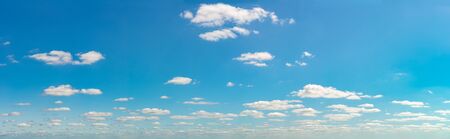 Fantastic clouds against blue sky, panoramaの写真素材
