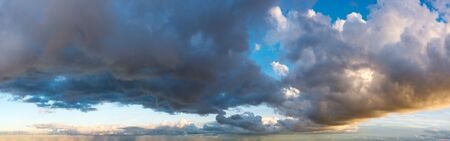 Fantastic clouds against blue sky, panoramaの写真素材