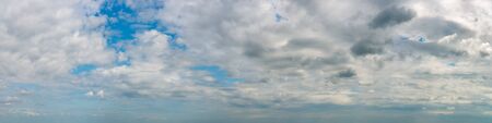 Fantastic clouds against blue sky, panoramaの写真素材