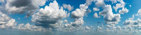 Fantastic clouds against blue sky, panoramaの写真素材