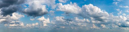 Fantastic clouds against blue sky, panoramaの写真素材