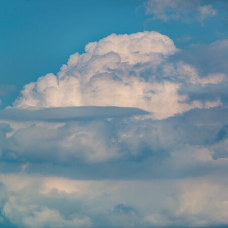 Fantastic clouds against blue skyの写真素材