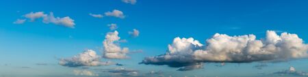 Fantastic clouds against blue sky, panoramaの写真素材