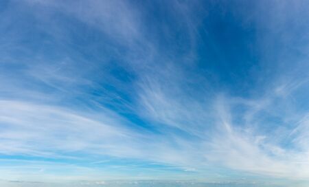 Fantastic clouds against blue sky, panoramaの写真素材
