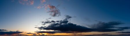 Fantastic clouds against blue sky, panoramaの写真素材