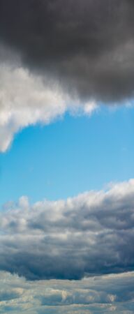 Fantastic clouds against blue sky, panoramaの写真素材