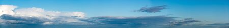 Fantastic clouds against blue sky, panoramaの写真素材