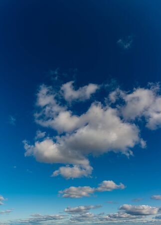 Fantastic clouds against blue sky, panoramaの写真素材