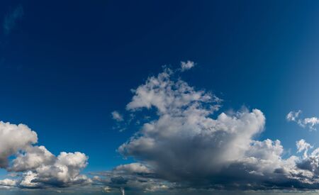 Fantastic clouds against blue sky, panoramaの写真素材