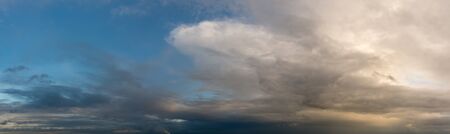 Fantastic clouds against blue sky, panorama