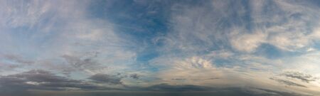 Fantastic clouds against blue sky, panoramaの写真素材