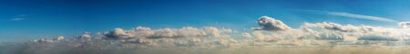 Fantastic clouds against blue sky, panoramaの写真素材