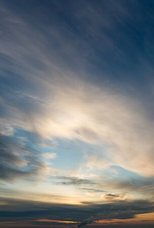 Fantastic clouds at sunrise, vertical panoramaの写真素材