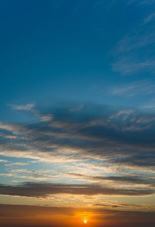 Fantastic clouds at sunrise, vertical panoramaの写真素材