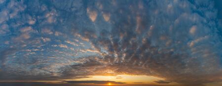Fantastic dark thunderclouds at sunriseの写真素材