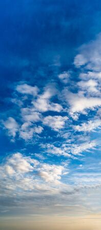 Fantastic clouds against blue sky, panoramaの写真素材