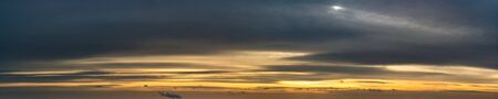 Fantastic dark thunderclouds at sunriseの写真素材