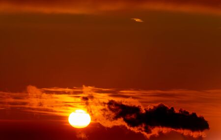 Smoke from pipes of thermal power plant at sunriseの写真素材