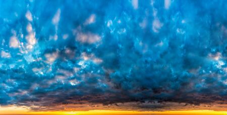Fantastic dark blue thunderclouds at sunrise, natural compositionの写真素材