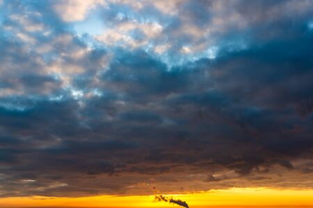 Fantastic dark blue thunderclouds at sunrise, natural compositionの写真素材