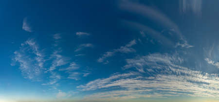 Fantastic clouds against blue sky, panorama