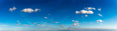 Fantastic clouds against blue sky, panorama