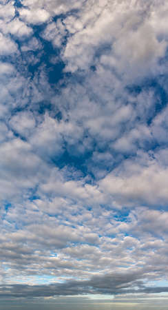 Fantastic clouds against blue sky, panoramaの写真素材