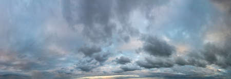 Fantastic dark thunderclouds, natural sky composition, wide panoramaの写真素材