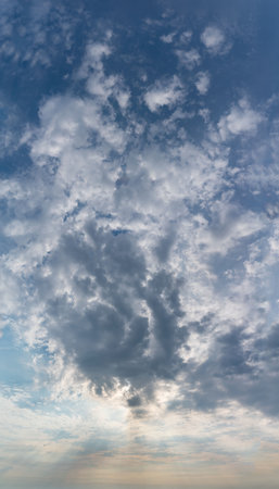Fantastic clouds at sunrise, vertical panoramaの写真素材