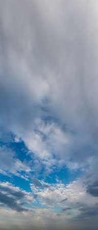 Fantastic clouds against blue sky, panoramaの写真素材